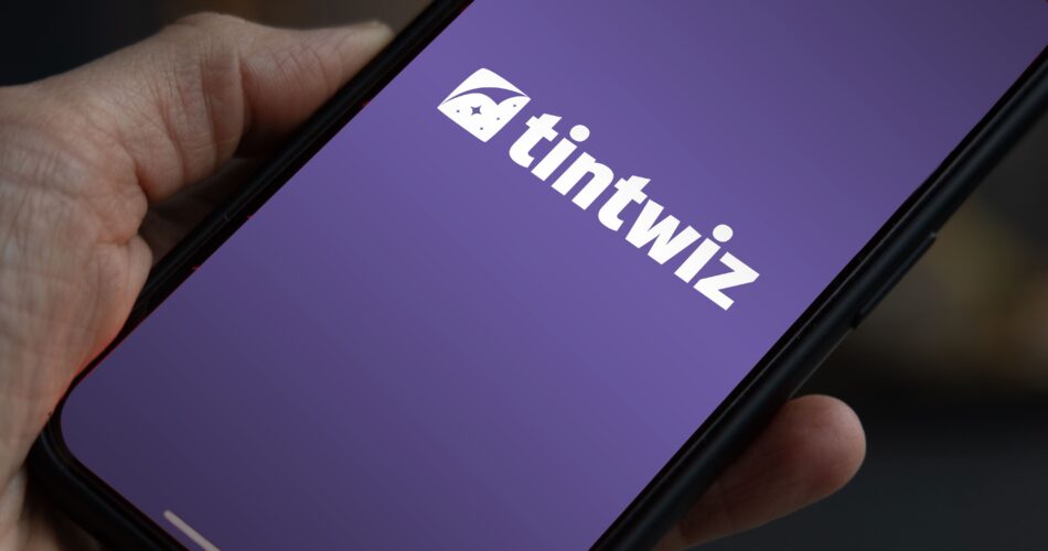 A smartphone displaying the Tint Wiz logo - a leading app for scheduling window tint appointments